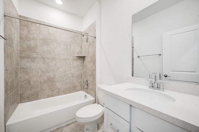 full bathroom featuring toilet, bathing tub / shower combination, and vanity