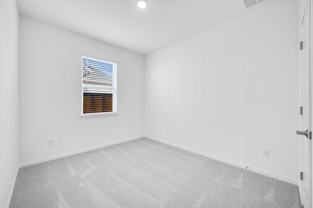 unfurnished room featuring baseboards, recessed lighting, and light colored carpet