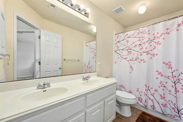 full bathroom with tile patterned flooring, vanity, shower / bath combination with curtain, and toilet