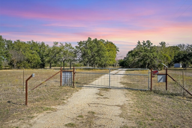 view of gate at dusk