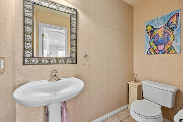 bathroom with tile patterned floors and toilet