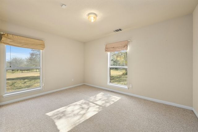 spare room featuring carpet