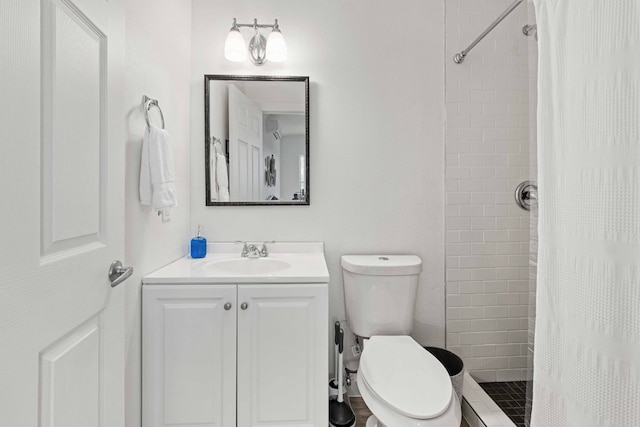 bathroom featuring toilet, walk in shower, and vanity