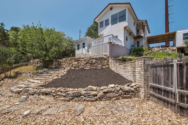 view of side of property with fence