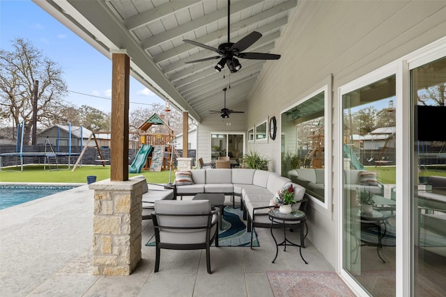 view of patio / terrace with outdoor lounge area, a playground, ceiling fan, and a trampoline