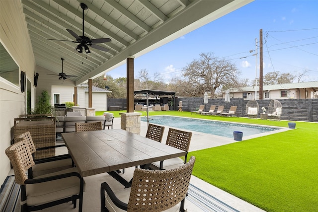 exterior space featuring ceiling fan, a patio, and a lawn