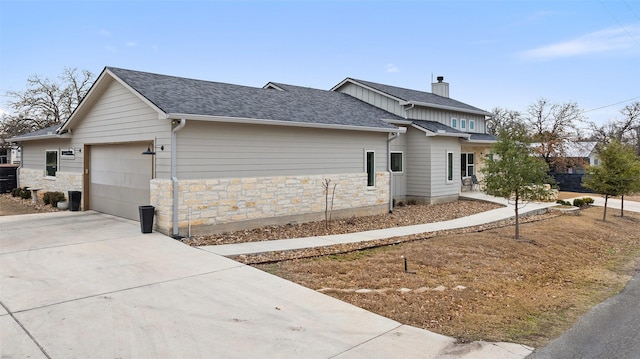 view of side of home featuring a garage