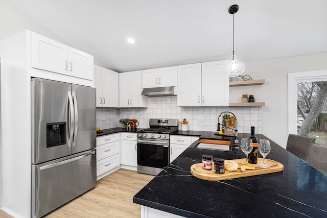 kitchen featuring white cabinetry, appliances with stainless steel finishes, sink, and decorative backsplash