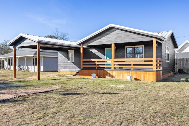 view of front of house with covered porch and a front yard