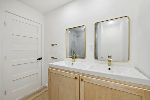 bathroom with wood-type flooring and vanity