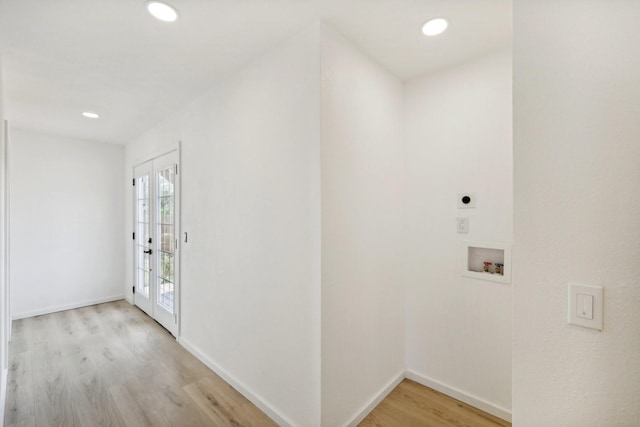 laundry room with hookup for an electric dryer, light wood-type flooring, hookup for a washing machine, and french doors