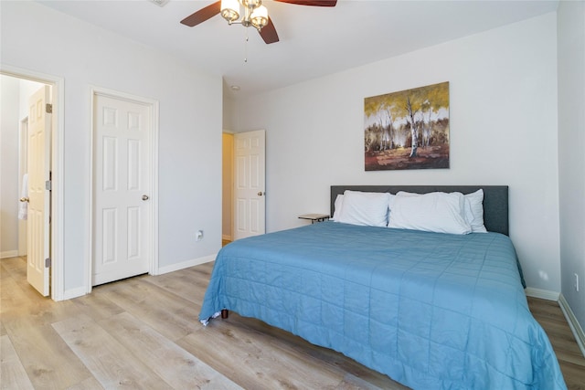 bedroom with ceiling fan and light hardwood / wood-style flooring