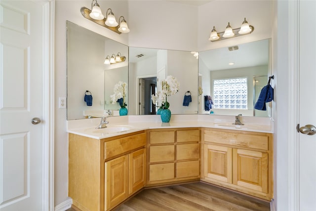 bathroom with hardwood / wood-style flooring and vanity