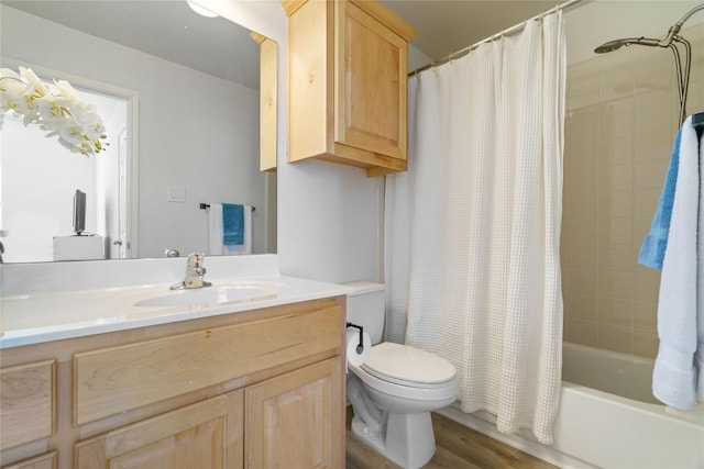 bathroom with shower / tub combo, vanity, toilet, and wood finished floors