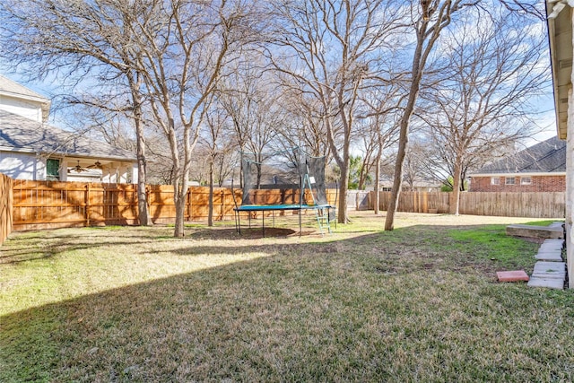 view of yard with a trampoline