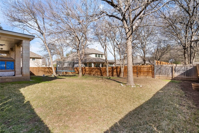 view of yard with a trampoline