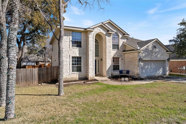 front of property featuring a garage and a front lawn