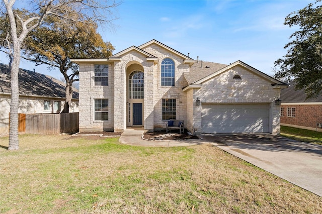 view of front property featuring a garage and a front lawn