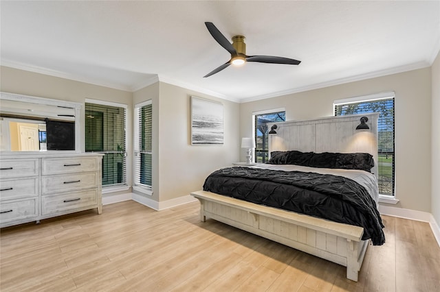 bedroom with light wood-type flooring, ceiling fan, and ornamental molding