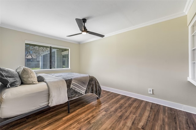 bedroom with ceiling fan, crown molding, and dark wood-type flooring