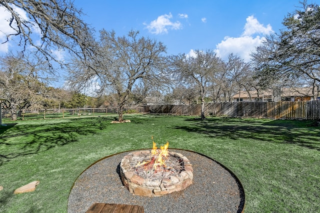 view of yard with an outdoor fire pit