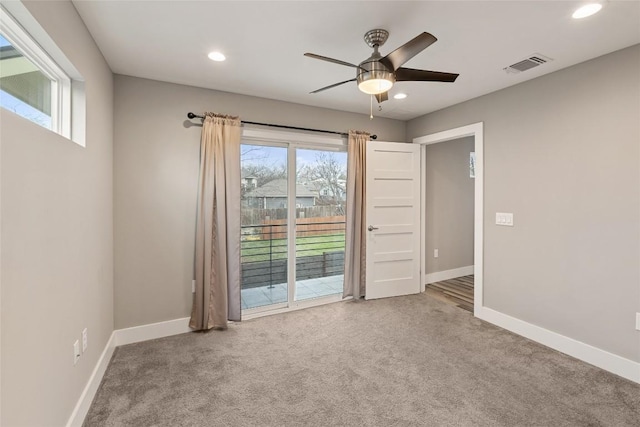 unfurnished room featuring carpet floors, recessed lighting, visible vents, and baseboards