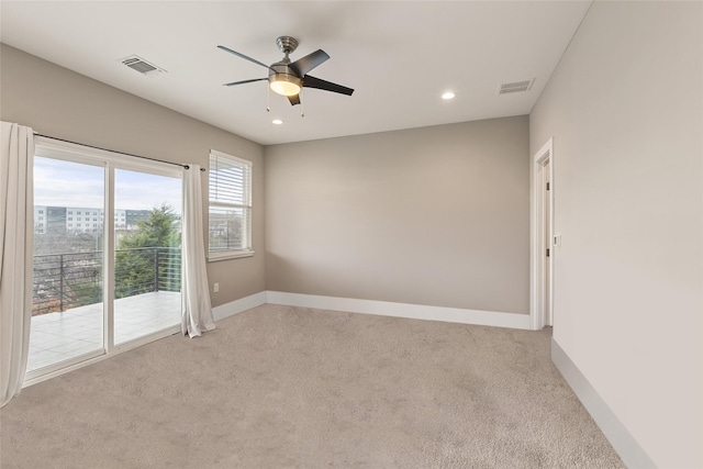 carpeted empty room with ceiling fan