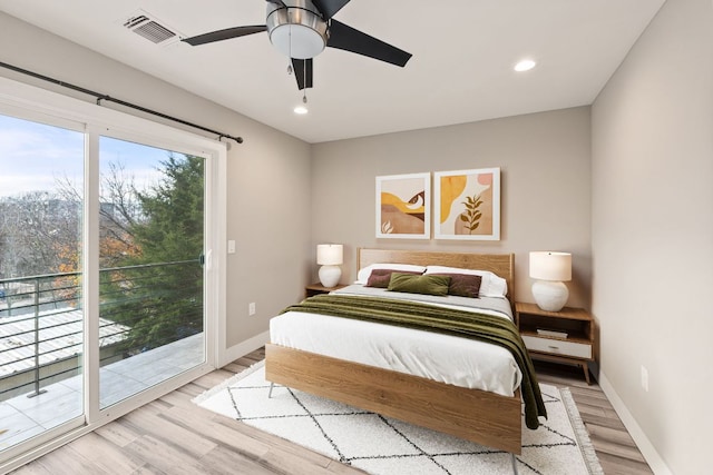 bedroom with access to outside, light wood-type flooring, visible vents, and baseboards