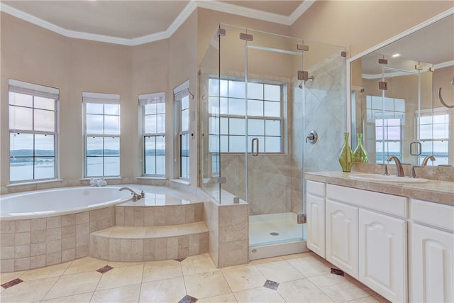 full bathroom with healthy amount of natural light, ornamental molding, a garden tub, and tile patterned floors