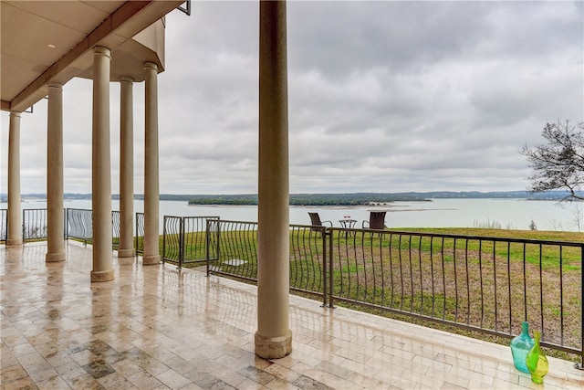 view of patio featuring a water view