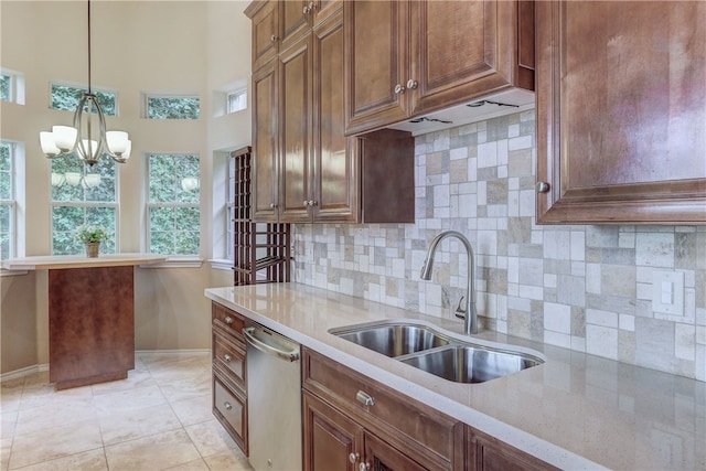 2918 Ranch Road 620 N Unit N-189, Austin, TX 78734 - kitchen featuring stainless steel dishwasher, a chandelier, decorative light fixtures, and decorative backsplash