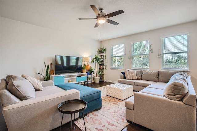 living room with hardwood / wood-style floors and ceiling fan