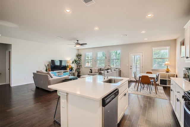 kitchen with sink, white cabinetry, an island with sink, a breakfast bar area, and stainless steel appliances