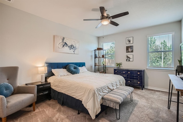 bedroom with multiple windows, carpet flooring, and ceiling fan