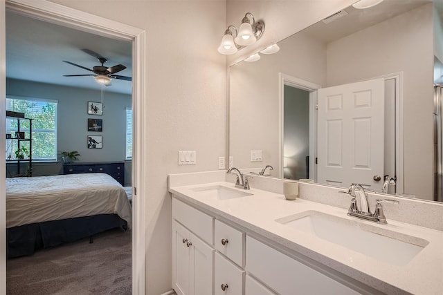 bathroom featuring ceiling fan and vanity