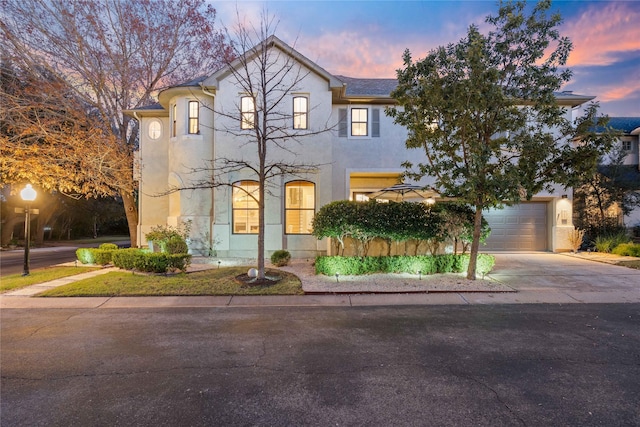 view of front of property with a garage