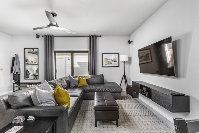 tiled living room featuring ceiling fan