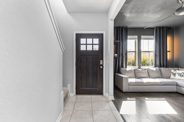 foyer with light tile patterned floors