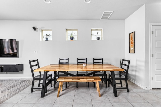 dining room with light tile patterned floors