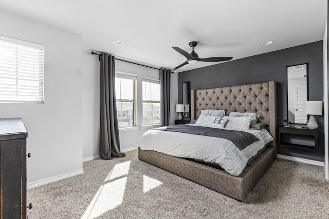 bedroom featuring ceiling fan and carpet