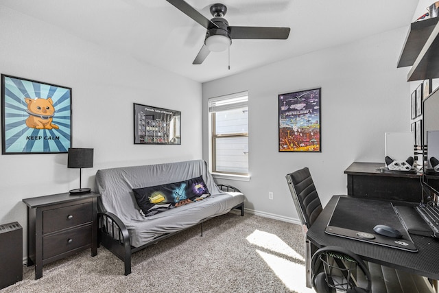 office area featuring light carpet and ceiling fan