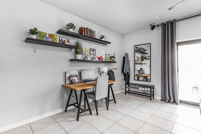 office area with light tile patterned floors