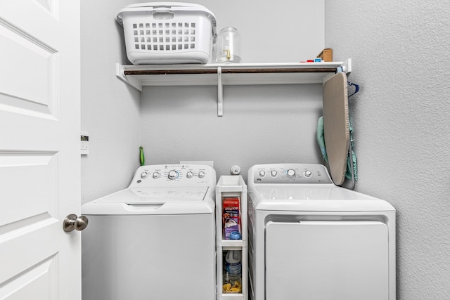 clothes washing area with separate washer and dryer