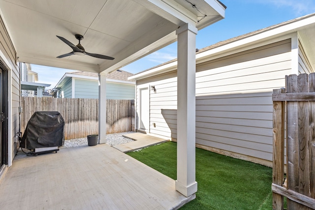 view of patio featuring area for grilling and ceiling fan