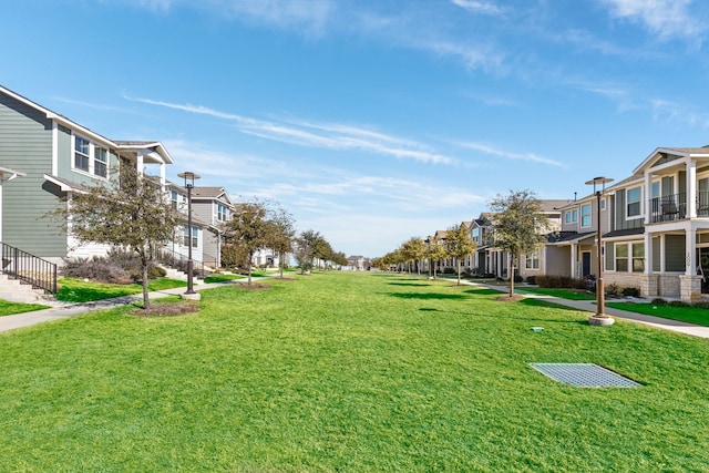 view of home's community featuring a yard