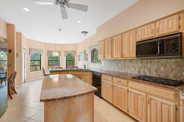 kitchen featuring backsplash, black appliances, a center island, and light tile patterned flooring