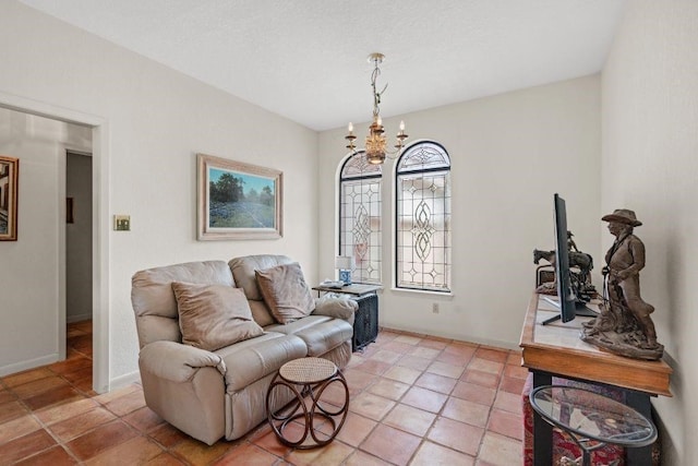 living room featuring a chandelier and light tile patterned floors