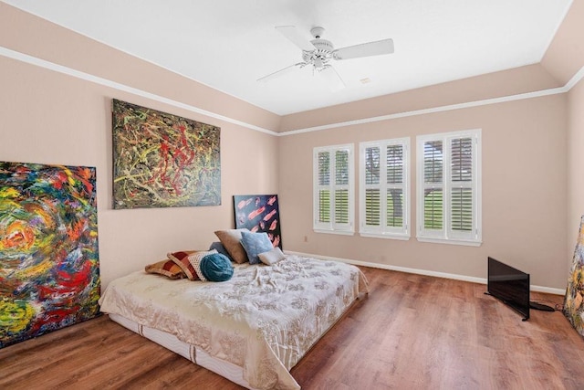 bedroom featuring lofted ceiling, hardwood / wood-style floors, and ceiling fan