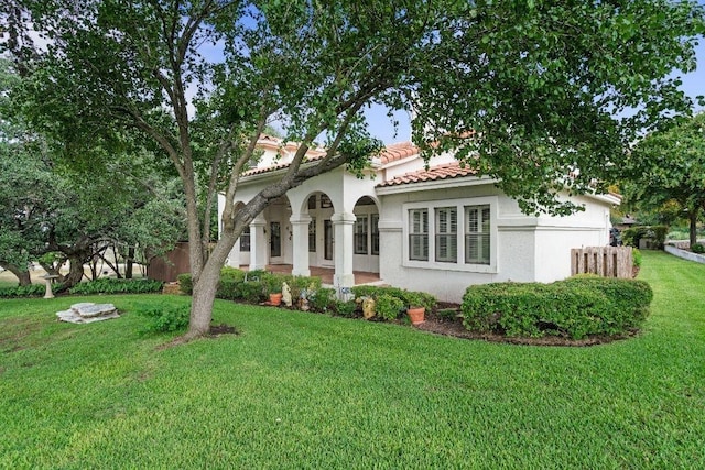 rear view of house with a yard