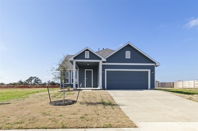 view of front facade with a garage and a front yard